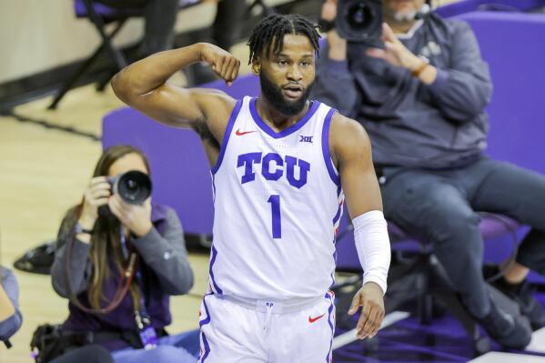 TCU guard Mike Miles Jr. (1) flexes after scoring a basket and being fouled by Texas Tech during the first half of an NCAA college basketball game, Saturday, Dec. 31, 2022, in Fort Worth, Texas. (AP Photo/Gareth Patterson)