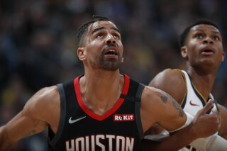 FILE - In a Sunday, Jan. 26, 2020 file photo, Houston Rockets forward Thabo Sefolosha (18), left, and Denver Nuggets guard PJ Dozier (35) in the second half of an NBA basketball game, in Denver. Time has not healed all wounds for Sefolosha, the NBA veteran who says he was attacked by a group of New York Police Department officers in April 2015 while they were arresting him outside a nightclub in the city’s Chelsea neighborhood.  (AP Photo/David Zalubowski, File)