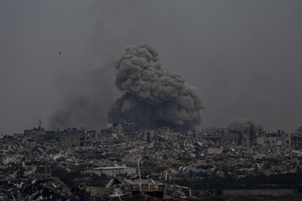 Smoke and explosions rise inside the Gaza Strip, as seen from southern Israel, Sunday, Sunday, March 17, 2024. (AP Photo/Ariel Schalit)