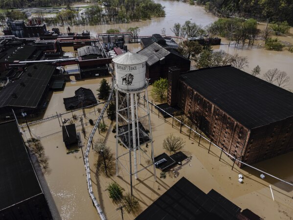 In an aerial view, the flooded Buffalo Trace Distillery is seen on Monday, April 7, 2025, in Frankfort, Ky. (AP Photo/Jon Cherry)