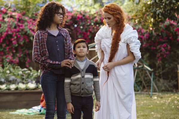 
              This image released by Disney shows Storm Reid, from left, Deric McCabe and Reese Witherspoon in a scene from "A Wrinkle In Time." (Atsushi Nishijima/Disney via AP)
            