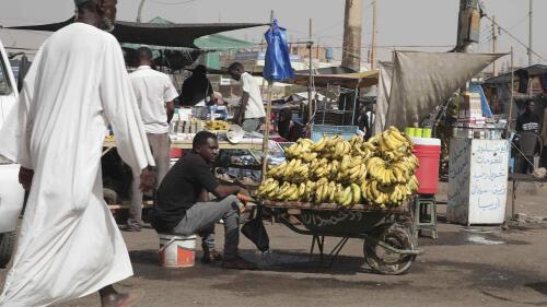 FILE - A man sells bananas at a market during a ceasefire in Khartoum, Sudan, Saturday, May 27, 2023. Two U.N. agencies are warning of rising food emergencies, including famine in Sudan due to the outbreak of war and in Haiti, Burkina Faso and Mali due to restricted Movement of people and goods.  The four countries are on the highest alert level alongside Afghanistan, Nigeria, Somalia, South Sudan and Yemen.  (AP Photo/Marwan Ali, file)