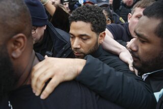 FILE - In this Feb. 21, 2019 file photo, "Empire" actor Jussie Smollett leaves Cook County jail following his release in Chicago. A Cook County grand jury on Friday, March 8, 2019 has indicted Smollett on 16 felony charges after authorities say he falsely told police that he was attacked by two men in Chicago. (AP Photo/Kamil Krzaczynski, File)