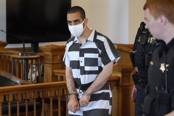 FILE - Hadi Matar, 24, center, arrives for an arraignment in the Chautauqua County Courthouse in Mayville, NY., Saturday, Aug. 13, 2022. Matar, the man charged with stabbing Salman Rushdie on a lecture stage in western New York on Friday, Aug. 12 said in an interview that he was surprised to learn the accomplished author had survived the attack. (AP Photo/Gene J. Puskar, File)