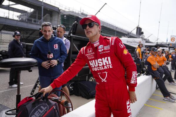 Marcus Ericsson, of Sweden, carries his gear after a session during an open test for the Indianapolis 500 auto race at Indianapolis Motor Speedway in Indianapolis, Thursday, April 20, 2023. (AP Photo/Michael Conroy)