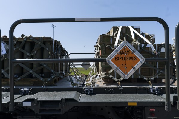 FILE - Pallets of 155 mm shells and fuses are loaded, ultimately bound for Ukraine, April 29, 2022, at Dover Air Force Base, Del. U.S. officials say on July 24, 2023, the Biden administration is sending up to $400 million in additional military aid to Ukraine (AP Photo/Alex Brandon)