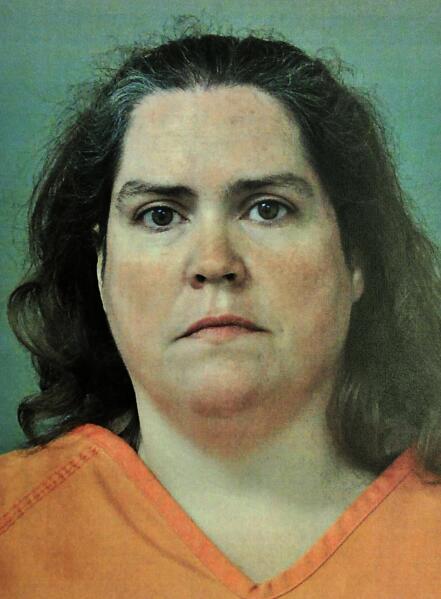 This photo provided by the Madison County, Ala.,  Sheriff's Department shows Rhonda Jean Carlson, who received a life sentence Wednesday, Oct. 27, 2021,  for helping her husband plan the 2015 killings of his estranged pregnant wife, her unborn child and three others. Carlson, 48, avoided the death penalty in a deal with prosecutors in exchange for testifying against her husband, Christopher Henderson, prior to his trial. She admitted to helping plan the attack and was sentenced to life in prison without the possibility of parole. (Madison County Sheriff's Department/AL.com, via AP, File)