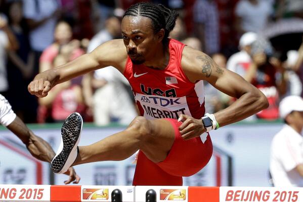 United States' Aries Merritt competes in a men’s 110m hurdles round one heat at the World Athletics Championships at the Bird's Nest stadium in Beijing, Wednesday, Aug. 26, 2015. (AP Photo/Lee Jin-man)