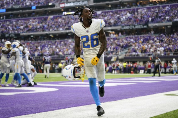 Los Angeles Chargers cornerback Asante Samuel Jr. (26) celebrates after an interception by teammate linebacker Kenneth Murray Jr. in the end zone during the second half of an NFL football game against the Minnesota Vikings, Sunday, Sept. 24, 2023, in Minneapolis. The Chargers won 28-24. (AP Photo/Abbie Parr)
