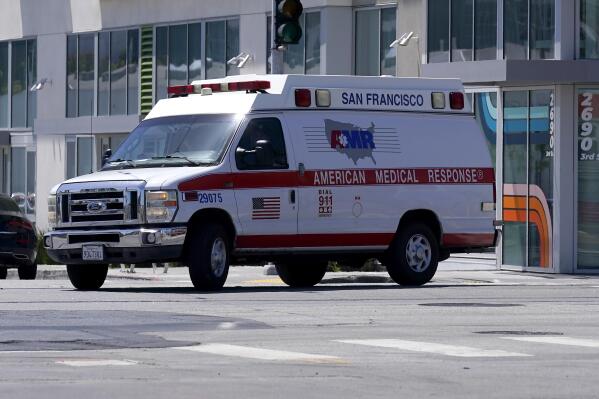 An American Medical Response vehicle drives in San Francisco, Monday, May 22, 2023. Lawyers sued medical transport provider American Medical Response West, saying the ambulance company's lax oversight allowed a paramedic to sexually assault two women in their 80s on their way to a hospital. (AP Photo/Jeff Chiu)