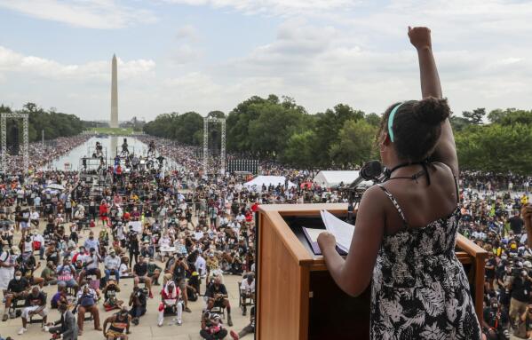 FILE - Yolanda Renee King, granddaughter of The Rev. Martin Luther King Jr., raises her fist as she speaks during the March on Washington, on the 57th anniversary of the Rev. Martin Luther King Jr.'s "I Have a Dream" speech on Aug. 28, 2020. California's first-in-the-nation task force on reparations is at a crossroads with members divided on which Black Americans should be eligible for compensation. The task force could vote on the question of eligibility on Tuesday, March 28, 2022, after putting it off at last month's meeting. (Jonathan Ernst/Pool Photo via AP, File)