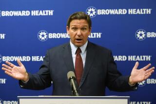 FILE - Florida Gov. Ron DeSantis speaks at a news conference, Thursday, Sept. 16, 2021, at the Broward Health Medical Center in Fort Lauderdale, Fla.  President Joe Biden’s plan to require vaccinations at all private employers of 100 workers or more has already hit a wall of opposition from Republican governors, state lawmakers and attorneys general.(AP Photo/Wilfredo Lee, File)