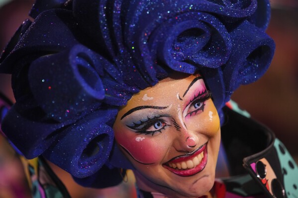 A dancer parades through Place Massena during the opening ceremony of 151st edition of the Nice Carnival in Nice, southern France, Saturday, Feb. 17, 2024. (AP Photo/Daniel Cole)