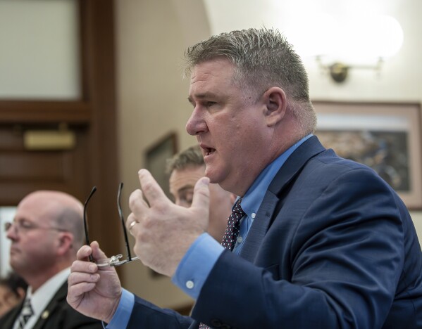 Maine State Police Col. William Ross answers questions from the Independent Commission to Investigate the Facts of the Tragedy in Lewiston during a hearing at Lewiston City Hall, Friday, May 24, 2024 in Lewiston, Maine. (Russ Dillingham /Sun Journal via AP)