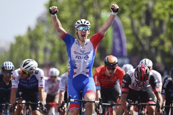 Arnaud Demare celebrates as he crosses the finish line to win the fifth stage of the Giro D'Italia cycling race from Catania to Messina, Italy, Wednesday, May 11, 2022. (Massimo Paolone/LaPresse via AP)