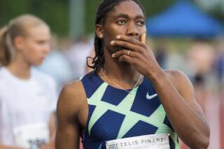 Caster Semenya reacts before the women's 5000 meter race in Regensburg, Saturday, June 19, 2021. The two-time 800-meter Olympic champion from South Africa once again missed out on qualifying for the Summer Games in Tokyo during her surprising start in Regensburg. (Stefan Puchner/dpa via AP)