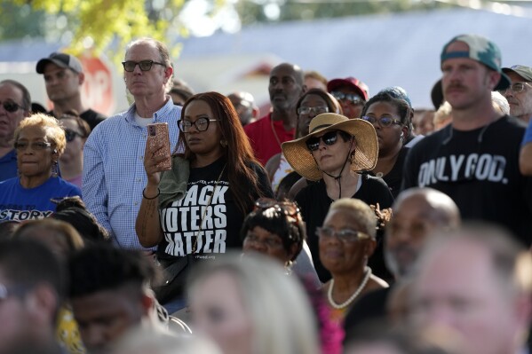 Residents of the Jacksonville community attend a prayer vigil for the victims of Saturday's mass shooting Sunday, Aug. 27, 2023, in Jacksonville, Fla. (AP Photo/John Raoux)
