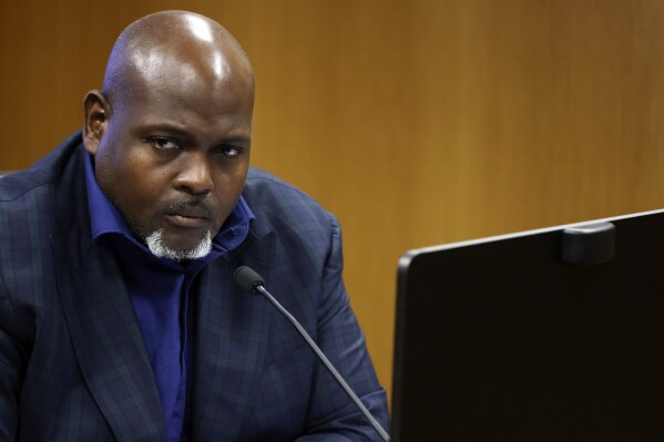 Terrence Bradley, Nathan Wade’s former business partner, testifies during a hearing on the Georgia election interference case, Friday, Feb. 16, 2024, in Atlanta. The hearing is to determine whether Fulton County District Attorney Fani Willis should be removed from the case because of a relationship with Wade, special prosecutor, she hired in the election interference case against former President Donald Trump. (Alyssa Pointer/Pool Photo via AP)