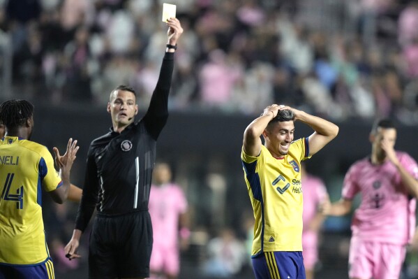 Real Salt Lake midfielder Pablo Ruiz reacts as he is given a yellow card during the first half of the team's MLS soccer match against Inter Miami, Wednesday, Feb. 21, 2024, in Fort Lauderdale, Fla. (AP Photo/Lynne Sladky)