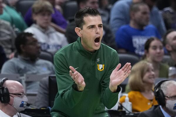 San Francisco head coach Todd Golden applauds his team during the first half of a college basketball game against Murray State in the first round of the NCAA tournament, Thursday, March 17, 2022, in Indianapolis. (AP Photo/Darron Cummings)