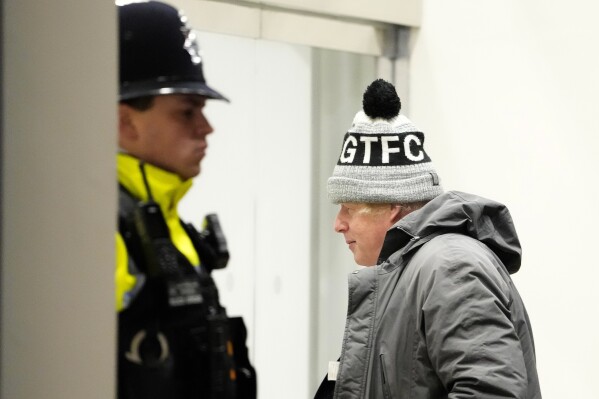 Britain's former Prime Minister Boris Johnson arrives for the COVID Inquiry at Dorland House in London, Thursday, Dec. 7, 2023. (AP Photo/Kirsty Wigglesworth)