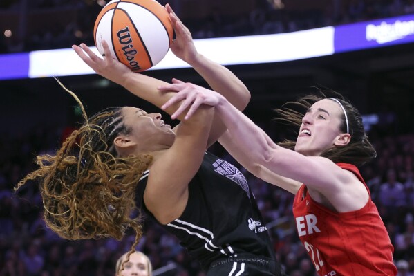 Golden State Valkyries' Veronica Burton is fouled by Indiana Fever's Caitlin Clark in 4th quarter during Valkyries' 88-77 win in WNBA game at Chase Center in San Francisco on Thursday, June 19, 2025. (Scott Strazzante/San Francisco Chronicle via AP)