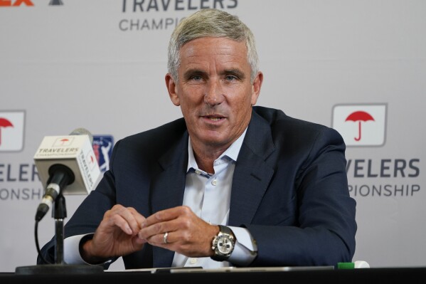 FILE - PGA Tour Commissioner Jay Monahan speaks during a news conference before the Travelers Championship golf tournament at TPC River Highlands, in Cromwell, Conn., June 22, 2022. Back to full health, Monahan said Wednesday, Aug. 9, 2023, the PGA Tour is on the right path to finalize a deal with the Saudi backers of LIV Golf and that whether he's the best person to lead the tour will depend on the results. Monahan spoke publicly for the first time since he returned to work July 17, having stepped away for three weeks with what he described as anxiety that had been building up over time. (AP Photo/Seth Wenig, File)