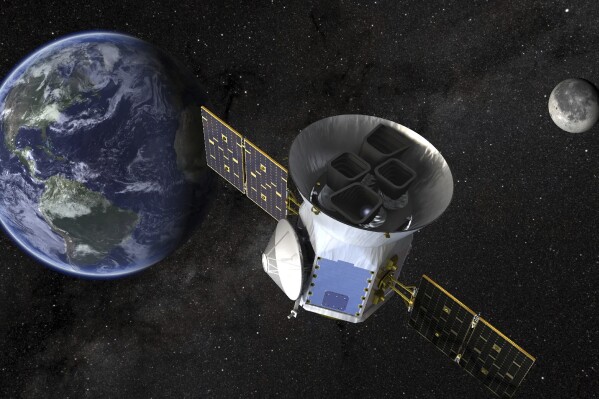 This image provided by NASA shows an artist鈥檚 illustration of the Tess telescope. Astronomers have discovered six planets orbiting a bright nearby star in perfect rhythmic harmony. They say it's a rare, frozen-in-time cosmic wonder that can help explain how solar systems across the galaxy came to be. The compact in-sync system, announced Wednesday, is 100 light-years away. (NASA via AP)