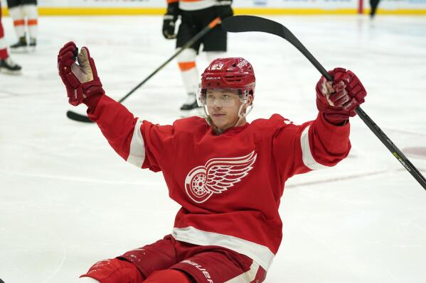 Detroit Red Wings left wing Lucas Raymond (23) celebrates his goal against the Philadelphia Flyers in the second period of an NHL hockey game Tuesday, March 22, 2022, in Detroit. (AP Photo/Paul Sancya)