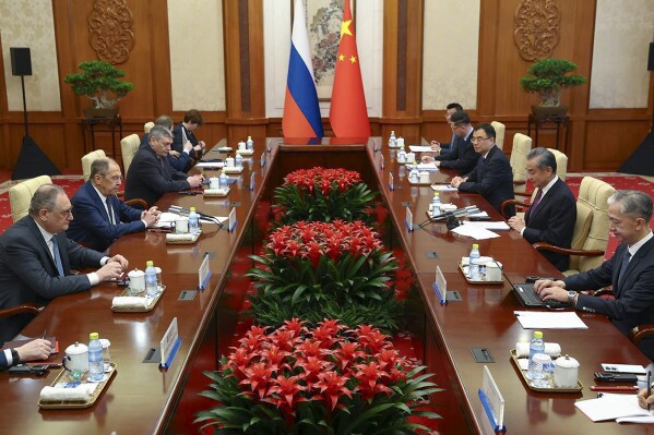 In this photo released by Russian Foreign Ministry Press Service in their telegram channel on Tuesday, April 9, 2024, Russian Foreign Minister Sergey Lavrov, second left, and Chinese Foreign Minister Wang Yi, second right, attend the talks in Beijing, China. (Russian Foreign Ministry Press Service telegram channel via AP)