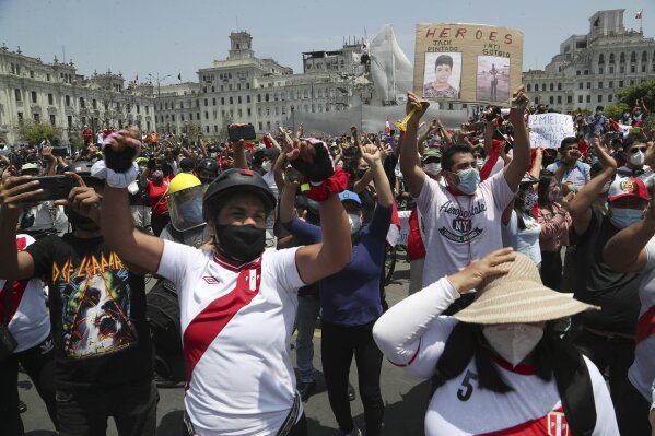 People celebrate after the resignation of interim president Manuel Merino, at Plaza San Martin in Lima, Peru, Sunday, Nov. 15, 2020. Merino resigned after a violent crackdown on protests that left at least two people dead followed by an exodus of his cabinet members. (AP Photo/Martin Mejia)