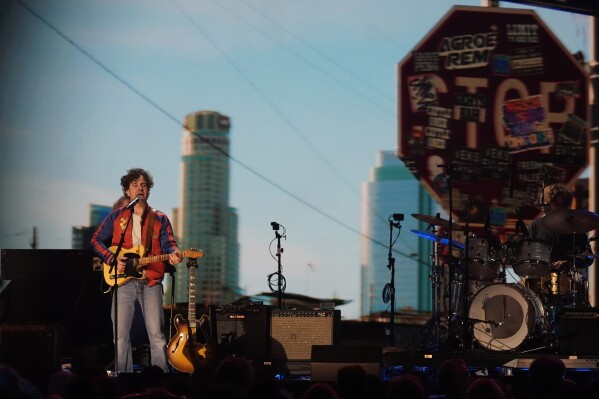 Taylor Goldsmith of Dawes performs during the FireAid benefit concert on Thursday, Jan. 30, 2025, at The Forum in Inglewood, Calif. (AP Photo/Chris Pizzello)