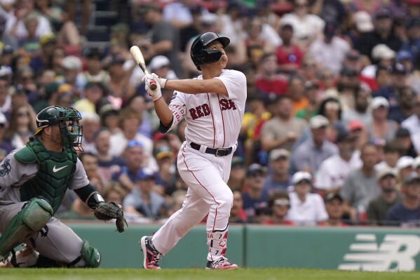 Masataka Yoshida of the Boston Red Sox walks back to the dugout