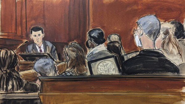 In this courtroom sketch, Sam Bankman-Fried testifies on the witness stand in Manhattan federal court, Friday, Oct. 27, 2023, in New York. (Elizabeth Williams via AP)