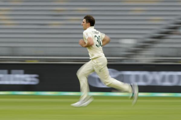 Australia's Pat Cummins runs in to bowl during play on the second day of the first cricket test between Australia and the West Indies in Perth, Australia, Thursday, Dec. 1, 2022. (AP Photo/Gary Day)