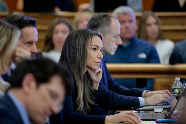 Karen Read listens to the testimony of Cellebrite digital intelligence expert Ian Wiffin, during her murder retrial, in Norfolk Superior Court, in front of Judge Beverly J. Cannone, in Dedham, Mass., Monday April 28, 2025. (Pat Greenhouse/The Boston Globe via AP, Pool)