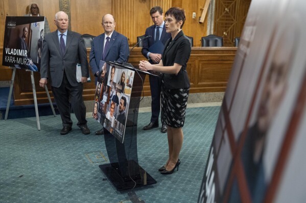 Sen. Ben Cardin, D-Md., left, Chair of the Senate Foreign Relations Committee, Sen. Chris Coons, D-Del., and James Roscoe, Deputy Head of Mission at the British Embassy Washington, listen as Evgenia Kara-Murza, human rights advocate and wife of Vladimir Kara-Murza, right, speaks about her husband during an event calling for the immediate release of Kara-Murza, who is a Russian opposition leader and journalist imprisoned by the Russian government, Tuesday, April 9, 2024, on Capitol Hill in Washington. (AP Photo/Jacquelyn Martin)