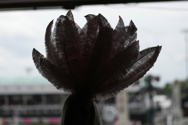 A race fan walk through the stands at Churchill Downs before the 151st running of the Kentucky Oaks horse race Friday, May 2, 2025, in Louisville, Ky. (AP Photo/Brynn Anderson)