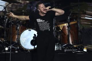 FILE - Dan Reynolds, of Imagine Dragons, performs at iHeartRadio ALTer EGO in Inglewood, Calif., on Jan. 15, 2022. Imagine Dragons are touring the U.S. this summer and fall, debuting songs from “Mercury,” their double album. (AP Photo/Chris Pizzello, File)