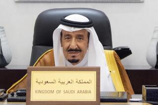 FILE- In this photo released by Saudi Royal Palace, Saudi King Salman attends the G20 Leaders' Summit via videoconference at the royal palace in Riyadh, Saudi Arabia on Oct. 30, 2021. Saudi Arabia’s octogenarian monarch underwent medical tests on Sunday, May 8, 2022, state-run media reported, just weeks after he had the battery of his pacemaker changed. (Bandar Aljaloud/Saudi Royal Palace via AP, File)