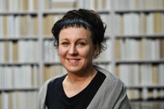 FILE - Polish writer and Nobel Prize winner Olga Tokarczuk poses for a portrait after a press conference in Duesseldorf, Germany, on Oct. 11, 2019. Polish Nobel literature laureate Olga Tokarczuk is among six finalists for the International Booker Prize for fiction in English translation. Tokarczuk’s 18th-century epic “The Books of Jacob” is a favorite to win the award, whose 50,000-pound ($65,000) prize money is split between a book’s author and its translator. (AP Photo/Martin Meissner)