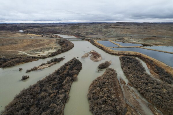 The Green River, a tributary of the Colorado River, flows on Thursday, Jan. 25, 2024, in Green River, Utah. (AP Photo/Brittany Peterson)