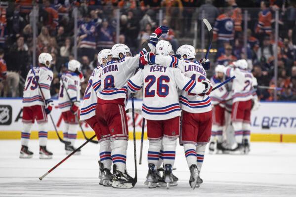 New York Rangers celebrate a shootout win over the Edmonton Oilers during an NHL hockey game Friday, Feb. 17, 2023, in Edmonton, Alberta. (Jason Franson/The Canadian Press via AP)