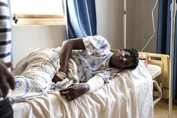 Ugandan LGBTQ+ activist Steven Kabuye receives treatment at a hospital after he was attacked by unknown people, in Kitende on the outskirts of Kampala, Uganda, Thursday, Jan. 4, 2024. Kabuye, a well-known gay rights activist was stabbed by unknown assailants Wednesday, and police said he was hospitalized in critical condition. (AP Photo/Hajarah Nalwadda)