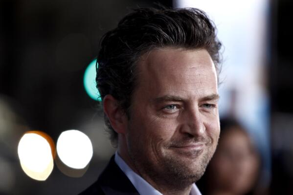 FILE - Matthew Perry arrives at the premiere of "The Invention of Lying" in Los Angeles on Sept. 21, 2009. Perry turns 53 on Aug. 19. (AP Photo/Matt Sayles, File)