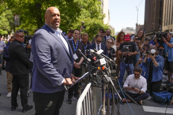 Former Capitol police officer Harry Dunn speaks to reporters in support of President Joe Biden across the street from former President Donald Trump's criminal trial in New York, Tuesday, May 28, 2024. (AP Photo/Seth Wenig)