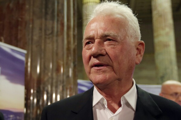 FILE - Austro-Canadian billionaire Frank Stronach of his party Team Stronach arrives at the parliament for a TV discussion during national elections in Vienna, Austria, Sunday, Sept. 29, 2013. Canadian police have charged Stronach with sexual assault dating back to the 1980s. Peel Regional police said in a statement that Stronach, 91, was arrested Friday, June 8, 2024, and charged with five crimes including, rape, indecent assault on a female, sexual assault and forcible confinement. (AP Photo/Matthias Schrader, File)