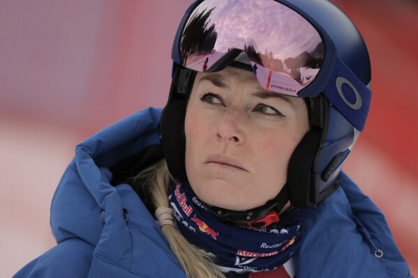 United States' Lindsey Vonn looks on ahead of an alpine ski, women's World Cup downhill training, in Garmisch-Partenkirchen, Germany, Friday, Jan. 24, 2025. (AP Photo/Giovanni Maria Pizzato, File)