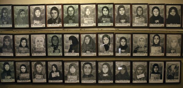 
              In this Monday, Jan. 7, 2019 photo, mug shots of former prisoners hang on the wall at a former prison run by the pre-revolution intelligence service, Savak, now a museum, in downtown Tehran, Iran.  Wax mannequins silently portray the horrific acts of torture that once were carried out within its walls. As Iran marks the 40th anniversary of its Islamic Revolution and the overthrow of the shah, those who suffered torture at the hands of the police and dreaded SAVAK intelligence service still bear the scars. (AP Photo/Ebrahim Noroozi)
            