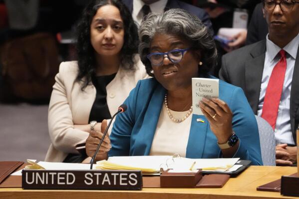 Linda Thomas-Greenfield, United States Ambassador to the United Nations, holds a copy of the United Nations charter as she speaks during a meeting of the U.N. Security Council, Monday, April 24, 2023, at United Nations headquarters. (AP Photo/John Minchillo)